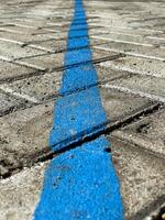 paving blocks with blue lines background photo