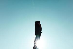 man silhouette portrait trekking in the mountain in summertime photo