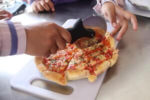 pizza cut with a round knife photo