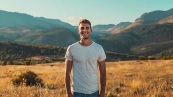 AI generated Male model with bright smile standing outdoors on a summer day. He wore a clean white t-shirt. And there are mountains in the background. photo