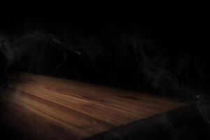 empty wooden table with smoke float up on dark background Empty Space for display your products. photo