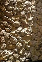 Patterns made from light and shadows on stone wall. photo