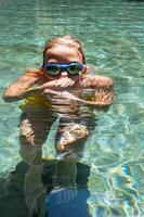 Teenager portrait underwater of swimming pool. photo