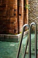 Summery poolside with sunlight and shadows. photo