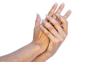 Hands of a woman with long nails without paint or touch-ups. photo