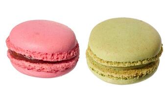 Raspberry and pistachio macaron on isolated background photo