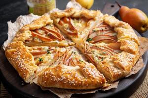 Galette with pear and blue cheese dipped in honey. Healthy eating. photo