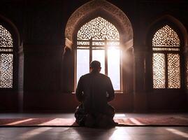 AI generated A person praying inside a majestic mosque, blending ancient architecture and religious devotion amidst intricate marble designs photo