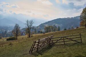 Wooden fence segments in the mountains photo