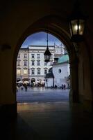 View of Krakow Square through an archway photo