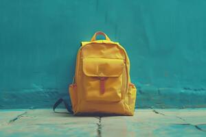 AI generated The yellow briefcase against a blue wall. Backpack, school briefcase, bagbook. Generated by artificial intelligence. photo