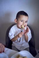 little boy plays with food photo