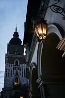 Streetlamp on the main square of Krakow in the evening photo