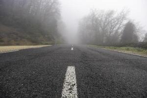 Foggy mountain road photo