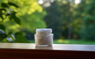 AI generated luxury cosmetic open cream jar on the table with green leaves in natural background photo