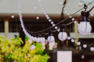 Chandeliers lined up in beautiful lines, outdoors, conveying a sense of luxury and dreaminess. photo