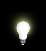 LED light bulb on black background photo