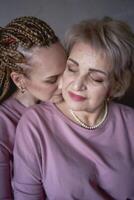 portrait of old mother and middle-aged daughter at home photo