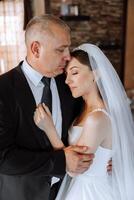 A beautiful bride with her father on her wedding day. The best moments of the wedding day. Daughter and father. photo