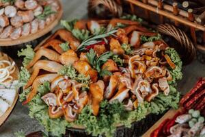 Meat and cheese snacks on the buffet. A buffet in a closed room, at a wedding celebration or birthday. Sandwiches on skewers before the start of the holiday. photo