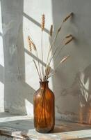 AI generated brown bottle holding wheat stalks against white wall photo