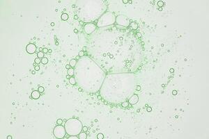 abstract science background, backlit green liquid biology or chemistry themed macro photograph photo