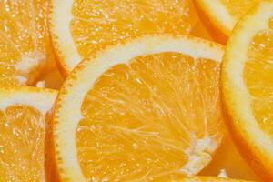 Sliced ripe oranges as a food background. Exotic fruits photo