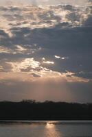 The afterglow of the sunset over the lake photo