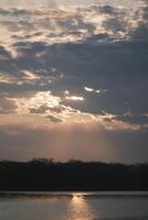 The afterglow of the sunset over the lake photo