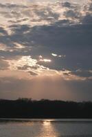 The afterglow of the sunset over the lake photo