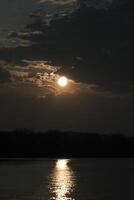 The afterglow of the sunset over the lake photo