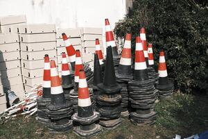 Roadblocks and building materials piled in an open space photo