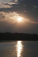 The afterglow of the sunset over the lake photo