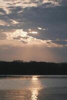 The afterglow of the sunset over the lake photo