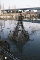 The foundation of an unfinished building filled with water photo
