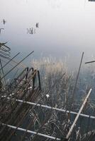 The foundation of an unfinished building filled with water photo