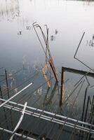 The foundation of an unfinished building filled with water photo