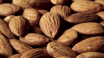 A rotating shot of almonds. The product is rich in minerals and vitamins. Texture of Almond kernels. Macro video