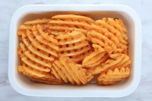 Top View Waffle Fries on White Plate photo