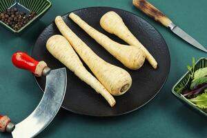 Edible fresh parsnip roots. photo