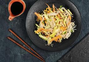 Salad with enoki mushrooms, Asian cuisine. photo