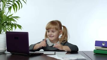 Online learning, distance education, lesson at home. Girl doing school program online on computer video