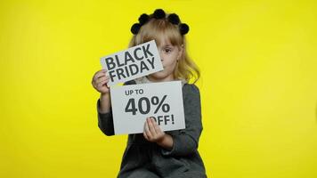 Child girl showing Black Friday and Up To 40 Percent Off advertisement banners. Low prices, shopping video