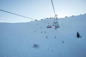 Cable car for skiers. Winter sports in the mountains. Sports and recreation concept. photo