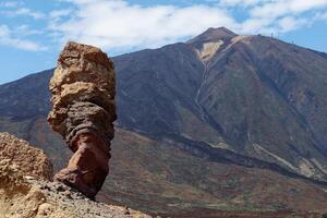 View of Mount Teide, with Roque Cinchado in the foreground. Roque Cinchado is a volcanic rock formation regarded as the symbol of the island of Tenerife, Canary Islands, Spain. Teide National Park. photo