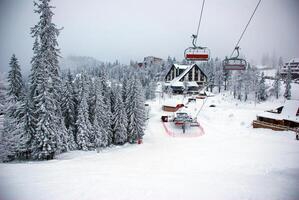 Cable car for skiers. Winter sports in the mountains. Sports and recreation concept. photo