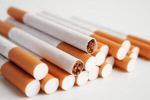 Cigarette, roll tobacco in paper with filter tube, No smoking concept. photo