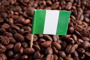 Nigeria flag on coffee beans, shopping online for export or import food product. photo