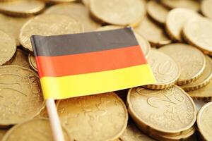Germany flag on coin and banknote money, finance trading investment business currency concept. photo