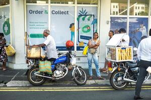 DECEMBER 3, 2019.MAURITIUS.Port Louis. a city street with people in the center of Port Louis, the capital of the island of Mauritius photo